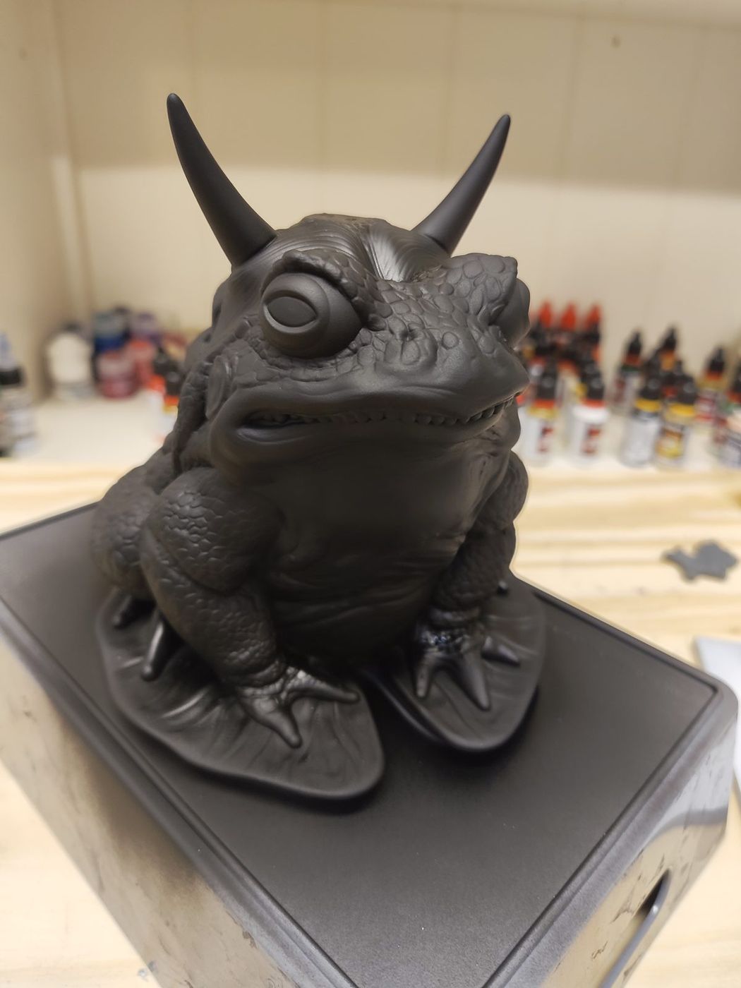 A horned toad figure printed in black resin