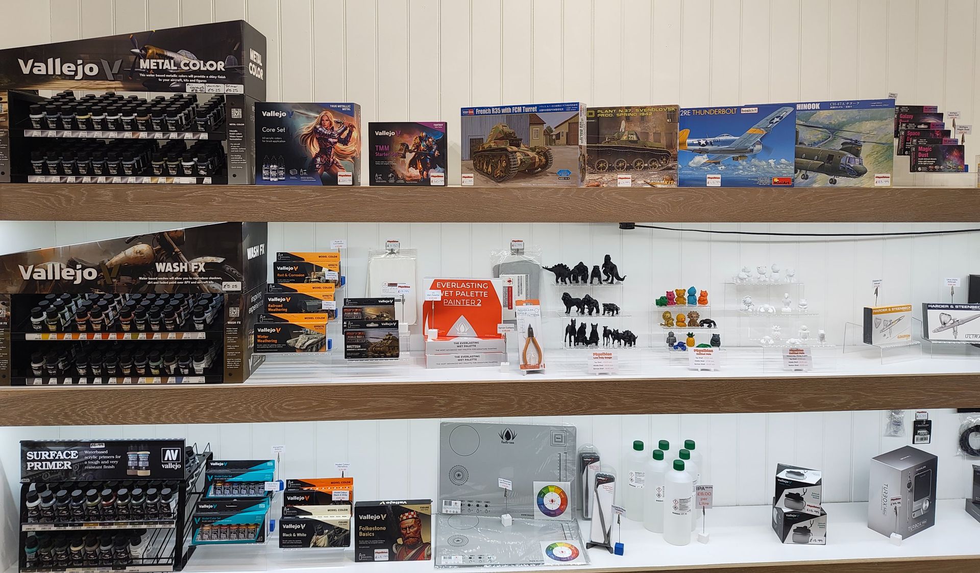 The shelves at Physibles: Vallejo paints, model kits, our own ranges and airbrushes