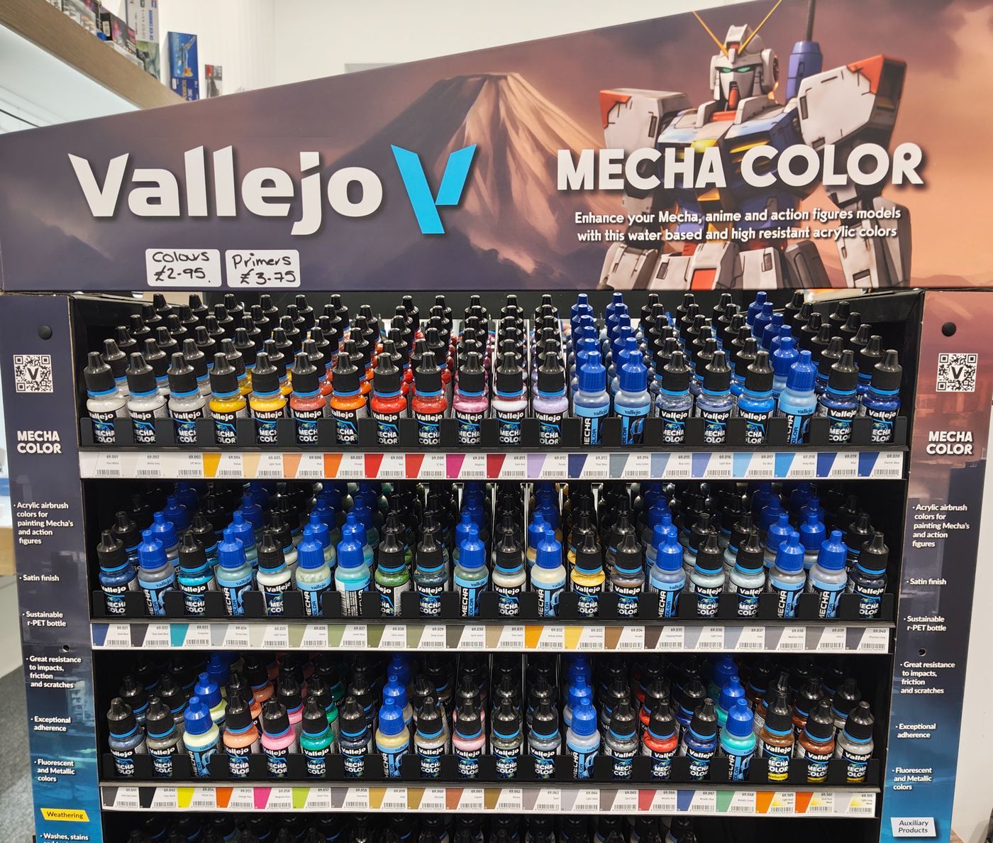 The Vallejo Mecha Color stand at Physibles, full of bottles